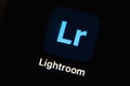 Mobile Adobe lightroom app icon isolated on black iPhone screen.