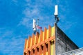 A mobile antenna mounted on a rooftop, providing wireless communication coverage Royalty Free Stock Photo