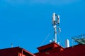 A mobile antenna mounted on a rooftop, providing wireless communication coverage Royalty Free Stock Photo
