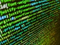 Mobile app developer. Shallow depth of field, selective focus effect. Lots of digits on the computer screen. Programmer working on Royalty Free Stock Photo