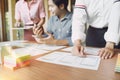 Mobile apps developers team designing, discussing together on a user interface wireframe screens layout. UI/UX front end designers Royalty Free Stock Photo