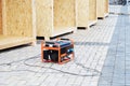 Mobile backup generator on the construction site. Standby generator - outdoor power equipment