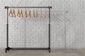 Mobile Black Coat Rack with Hangers. 3d Rendering