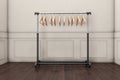 Mobile black coat rack with hangers