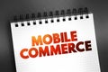 Mobile commerce - using wireless devices to conduct commercial transactions online, text concept on notepad Royalty Free Stock Photo