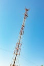 Mobile communication network communication tower with antens on the background of the sky Royalty Free Stock Photo