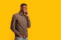 Mobile Communication. Positive African American Guy Talking On Cellphone And Looking Away Royalty Free Stock Photo