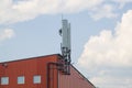 Mobile communication tower installed on the roof of the building Royalty Free Stock Photo