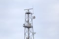 Mobile communication tower with many antennas. Royalty Free Stock Photo