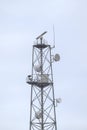 Mobile communication tower with many antennas.