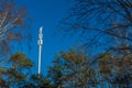 Mobile communications antenna tower in a forest Royalty Free Stock Photo