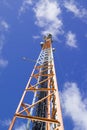 Mobile communications mast against blue sky Royalty Free Stock Photo