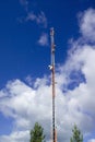 Mobile communications mast against blue sky Royalty Free Stock Photo