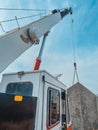 THE MOBILE CRANE LIFTING A PANEL PRECAST TO ThE SLOOF OF Royalty Free Stock Photo