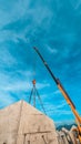 THE MOBILE CRANE LIFTING A PANEL PRECAST TO ThE SLOOF OF Royalty Free Stock Photo