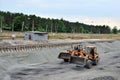 Mobile crane lifts the load on the construction site.