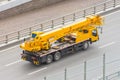 Mobile crane truck driving on the highway Royalty Free Stock Photo