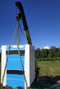 The mobile crane unloads pallets of blocks from the trailer of the truck