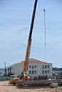 Mobile crane used to lifting heavy material at construction site