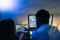Mobile developers team writes program code on a computer, programmers work in home office
