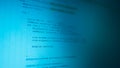 Mobile development code background. Blue monitor with programming