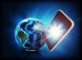 Mobile in forefround, earth on abstract background Royalty Free Stock Photo