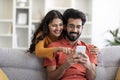 Mobile Gaming. Cheerful Indian Couple Playing Online Games On Smartphone At Home Royalty Free Stock Photo