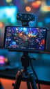 Mobile Gaming Setup with Phone Mounted on Controller and Backlit Accessories in a Dark Room Scene Royalty Free Stock Photo