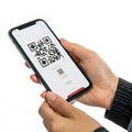 Mobile in hand scanning QR code isolated on white background