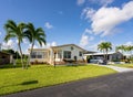 Mobile homes with palm trees. Photo of low income housing development in Florida USA