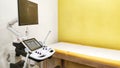 Mobile hospital bed with medical equipments in a clinic. Interior of hospital room for ultrasonic diagnostics. Royalty Free Stock Photo