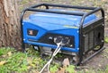 Mobile house backup generator outdoors, portable generator for home emergency. Backup generator control panel