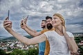 Mobile internet social networks. Mobile dependency problem. Bloggers team. Girl and man with mobile smartphones Royalty Free Stock Photo