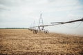 Mobile irrigation pivot watering a field