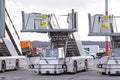 Mobile ladders for boarding and disembarking passengers on airplanes