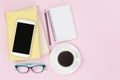 Mobile on old two books and notebook pencil glasses black coffee Royalty Free Stock Photo