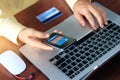 Mobile payments, man using mobile payments and credit card for online shopping Royalty Free Stock Photo