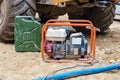 Mobile petrol power generator and jerry can with petrol Royalty Free Stock Photo