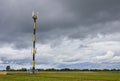 Mobile phone antenna, telecommunication tower with clouds on center blue sky, cell antenna, transmitter, cell phone tower,  teleco Royalty Free Stock Photo