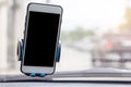 Mobile phone with black blank screen map gps navigation in car windshield holder. Royalty Free Stock Photo