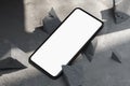 Mobile phone with blank screen near concrete broken forms on concrete floor. 3d rendering.