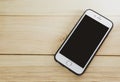 Mobile phone with blank screen on wooden Royalty Free Stock Photo