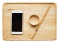 mobile phone and bowl chopstick made from wood on wood plate