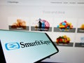 Mobile phone with business logo of Irish packaging company Smurfit Kappa Group plc on screen in front of web page. Royalty Free Stock Photo