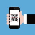 Mobile phone in businessman hand scanning qr code