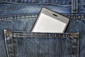 Mobile phone, cellphone in back pocket blue jeans Royalty Free Stock Photo