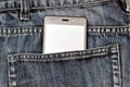 Mobile phone, cellphone in back pocket blue jeans Royalty Free Stock Photo