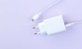 Mobile phone charger for fast charge USB cable on purple background Royalty Free Stock Photo