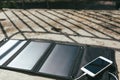 Mobile phone is charging from the solar panel Royalty Free Stock Photo