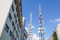 Mobile phone communication antenna tower with satellite dish on blue sky background, Telecommunication tower Royalty Free Stock Photo